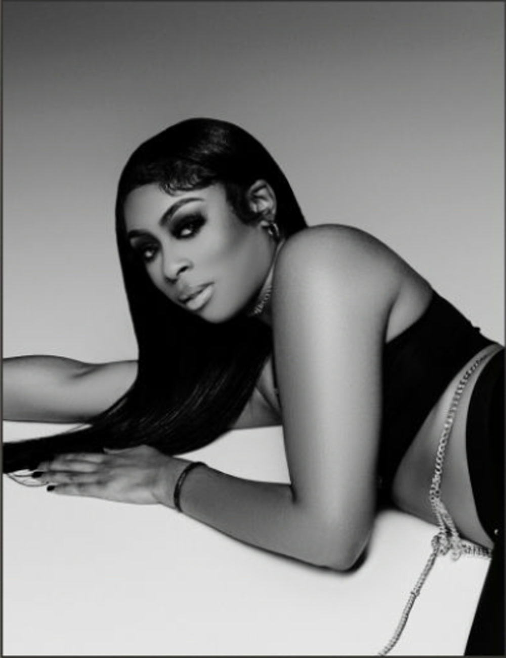 Christen, extensions specialist, in a black-and-white editorial portrait